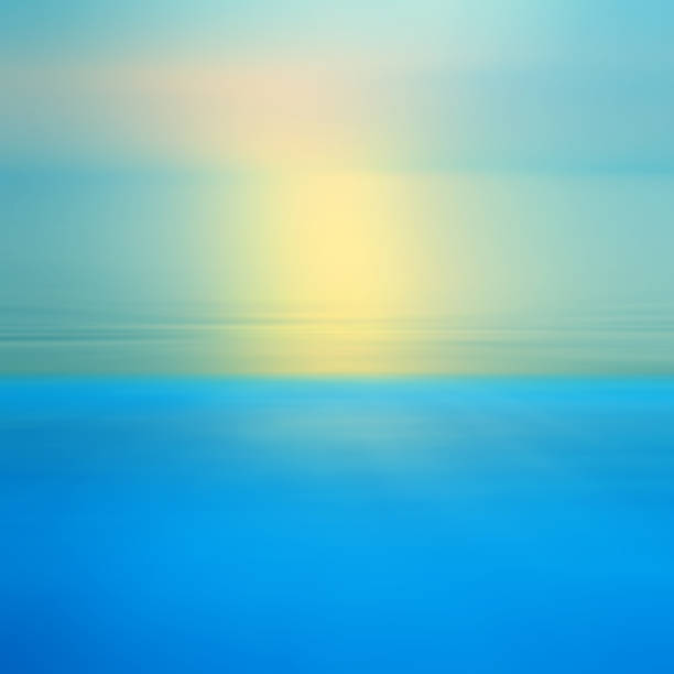 istock Motion blurred abstract background of refraction in water. Dramatic view of Infinity sunset on the sea at twilight times 1001974920