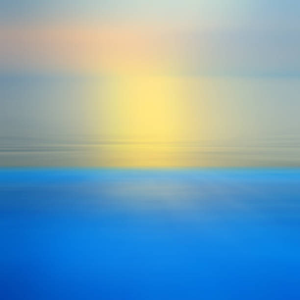 istock Motion blurred abstract background of refraction in water. Dramatic view of Infinity sunset on the sea at twilight times 1001974932