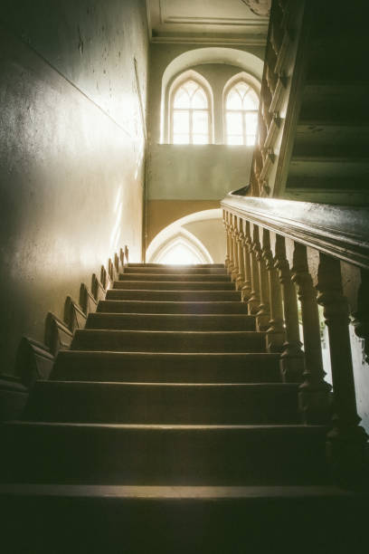 istock Abandoned stairs and room in old house 1001981202