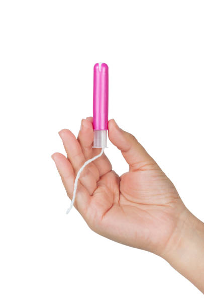 mano femenina sostiene un tampón con aplicador - tampon menstruation applicator hygiene fotografías e imágenes de stock