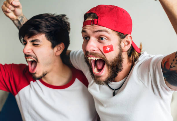 istock Friends cheering world cup with painted flag 1001990232