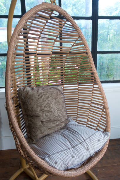 istock Garden swing with mattress and cushion in a balcony 1001993422