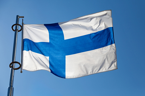 Flag of Finland waving atop of its pole.