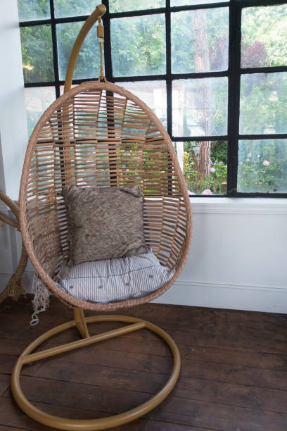 istock Garden swing with mattress and cushion in a balcony 1001997216