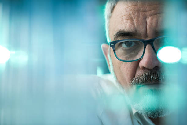 istock Close up of a senior scientist working in laboratory. 1002000288
