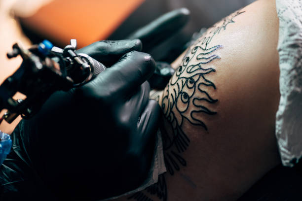 istock cropped shot of tattooing process on shoulder in salon 1002007062
