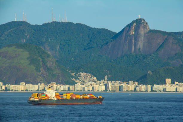 Cargo ship arriving in Rio de Janeiro with a mountains, hills in the background