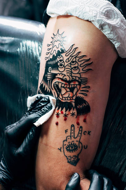 istock cropped shot of tattooing process on shoulder in salon 1002007094