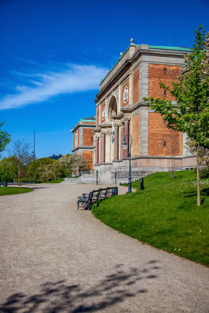 istock empty path and benches near beautiful old building in copenhagen, denmark 1002007790