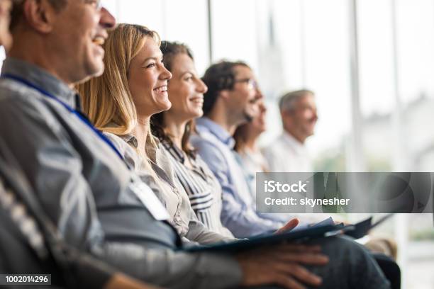 Happy Business People In A Line On A Training Class In The Office Stock Photo - Download Image Now