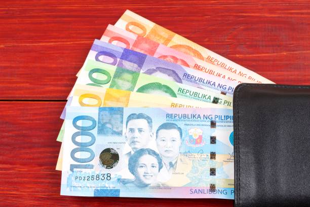istock Philippine peso in the black wallet 1002016906