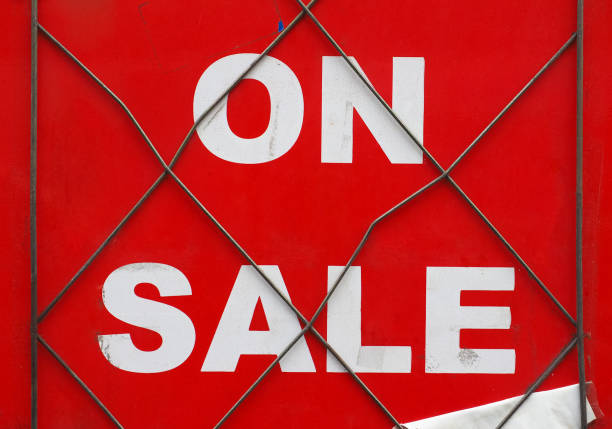 istock on sale sign in shop window 1002018206