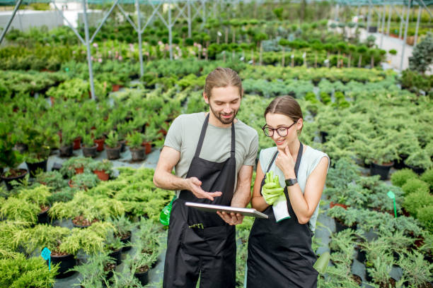 istock Workers with tablet in the greenhouse 1002018338