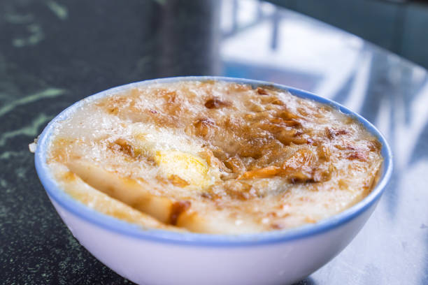 istock Taiwan's distinctive famous snacks: Savory rice pudding (Wa gui) in a white bowl on stone table, Taiwan Delicacies, Taiwan Street Food 1002021244