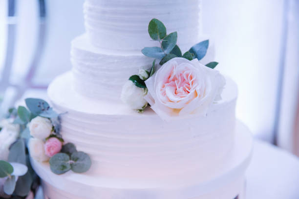 istock Beautiful wedding cake decorated with flowers 1002022060