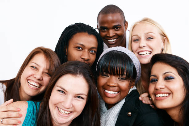 istock Smiling group of seven happy young people 1002022986