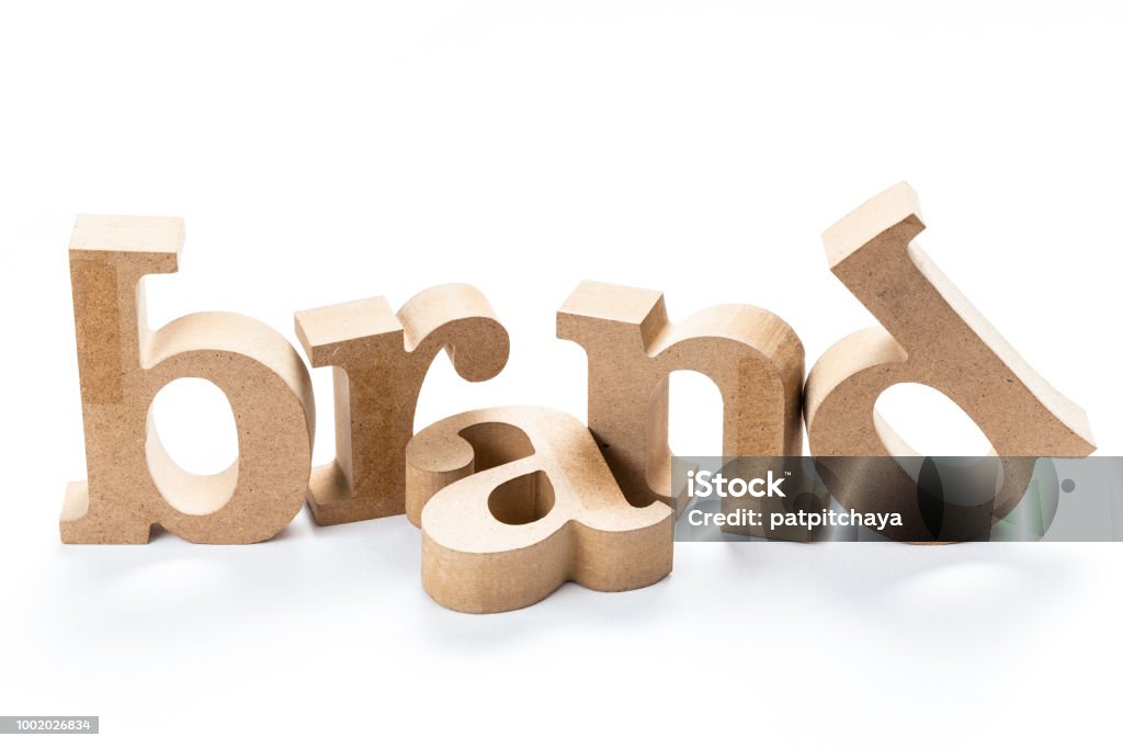 Brand wood word BRAND wood word isolated on white background, brand building, brand topic concept Advertisement Stock Photo