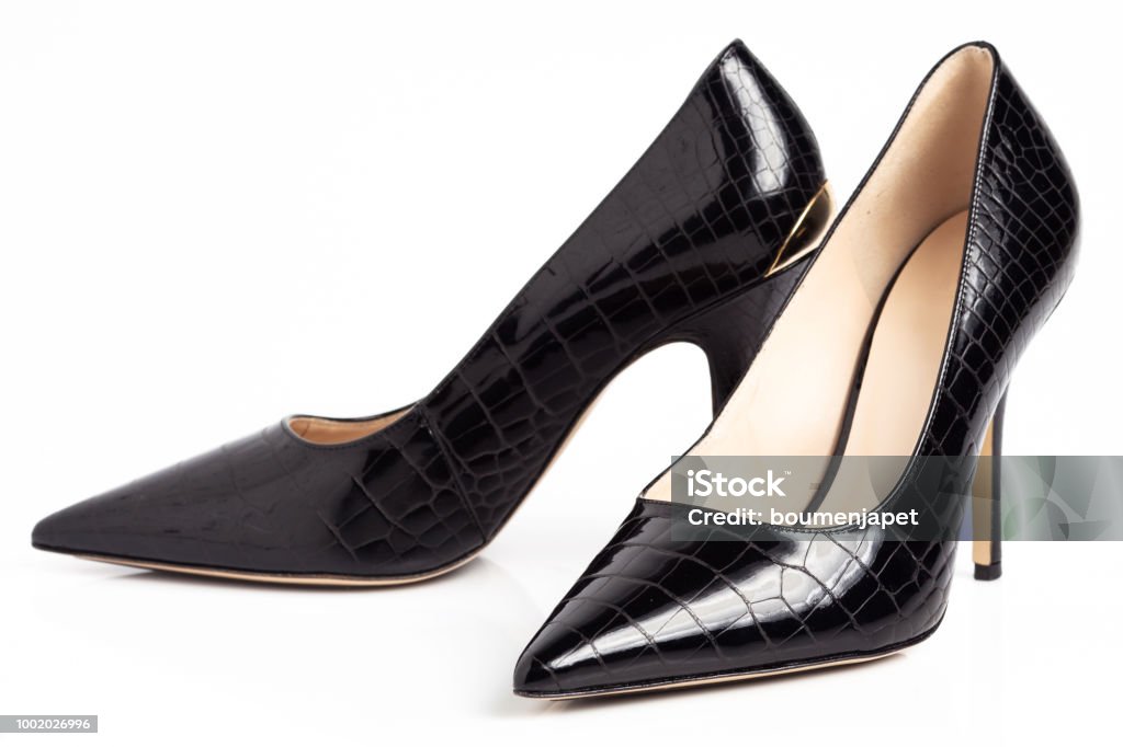 Black high heel female shoes Black high heel shoes isolated on a white background. High Heels Stock Photo