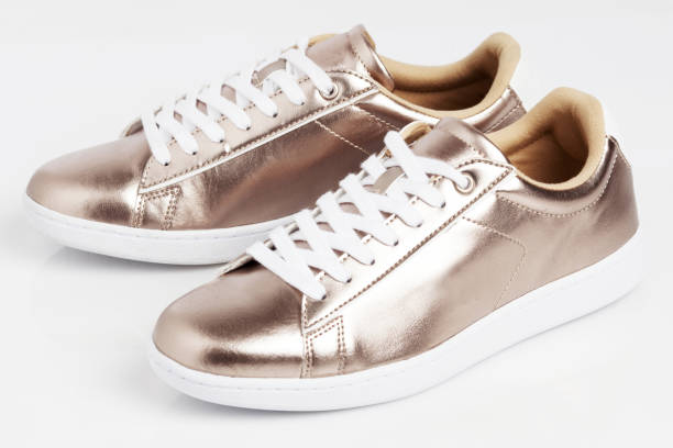 istock Gold shiny sneakers 1002027034