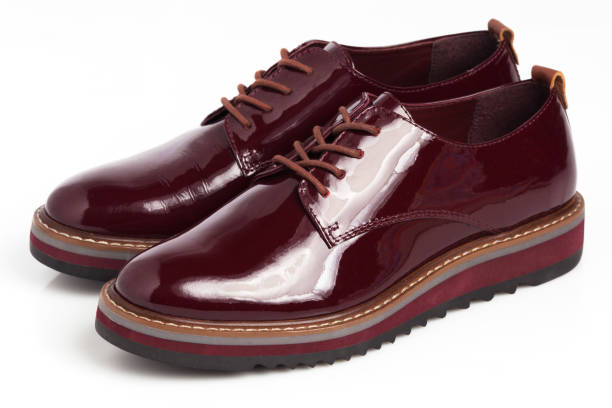 istock Deep red shiny pair of shoes 1002027070