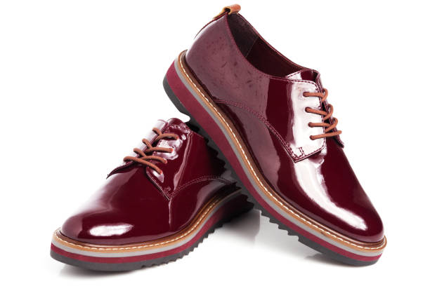 istock Deep red shiny pair of shoes 1002027128