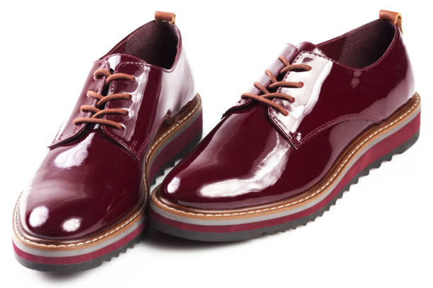 istock Deep red shiny pair of shoes 1002027138
