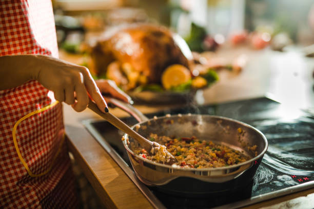 Unrecognizable woman preparing side dish for Thanksgiving dinner.