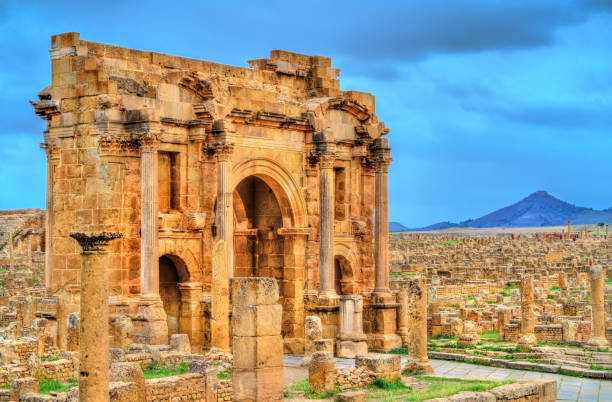 Trajan Arch within the ruins of Timgad in Algeria Trajan's Arch within the ruins of Timgad, UNESCO heritage in Algeria. algeria stock pictures, royalty-free photos & images
