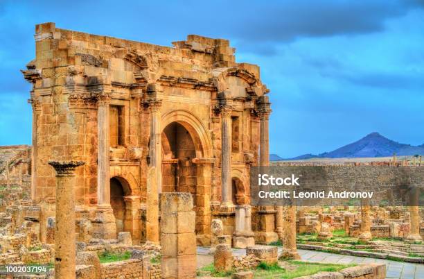 Trajan Arch Within The Ruins Of Timgad In Algeria Stock Photo - Download Image Now - Algeria, Roman, Old Ruin