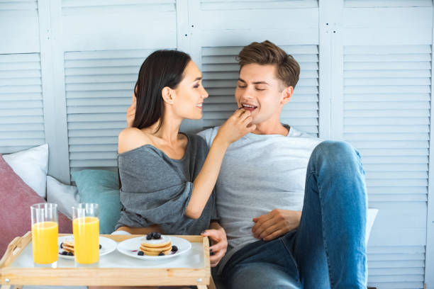240+ Wife Feeding Her Husband Breakfast In Bed Stock Photos, Pictures ...