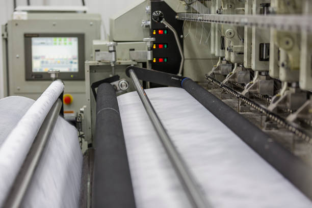 istock Modern equipment at textile factory 1002051184