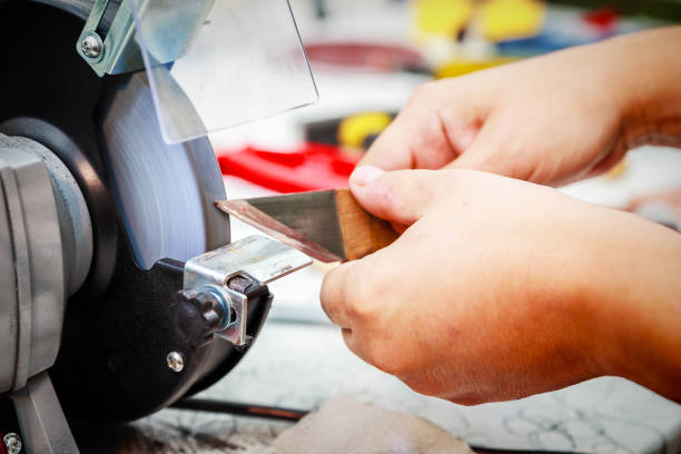 istock Sharpening the metal cutter on the grinding machine 1002057432