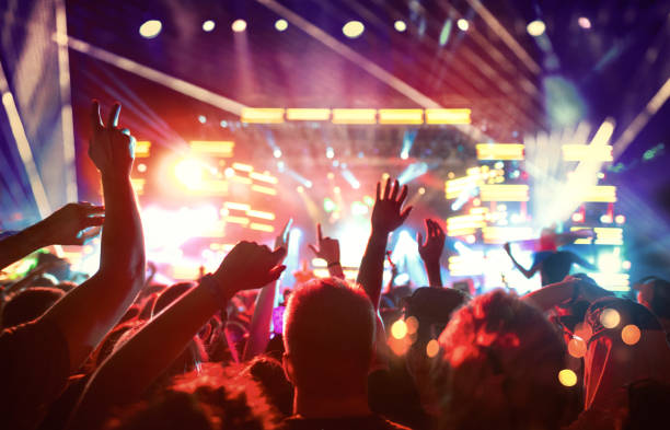 istock Large group of fans at a concert. 1002068712