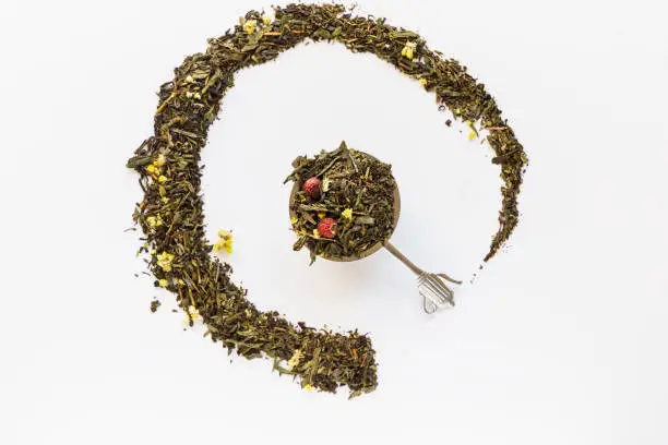 Useful dry herbal tea on a white background. Top view