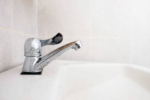 istock Close up faucet in the bathroom , save water concept 1002069364
