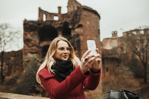 Young woman taking a selfie while exploring Heidelberg