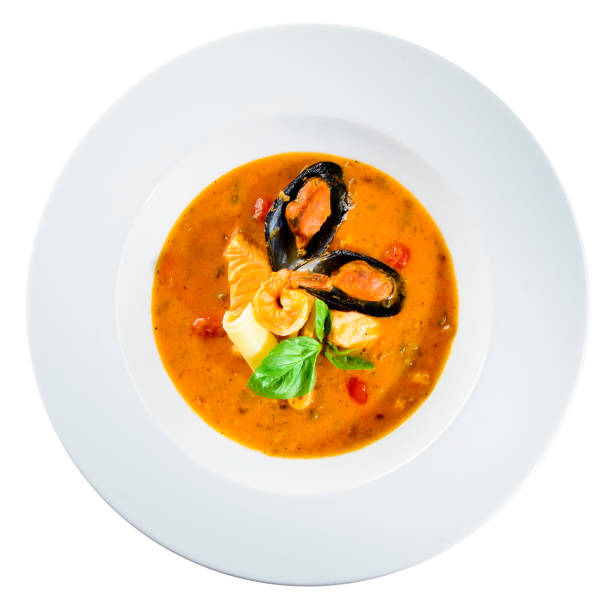 istock Homemade appetizing seafood soup with tomato sauce and coconut m 1002076508