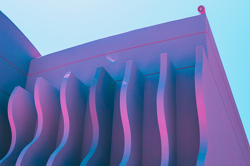 wave shapes on the hotel's wall. ultra violet holographic colors