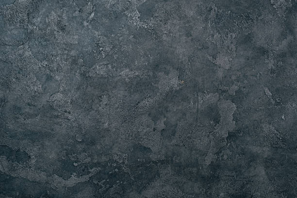 istock top view of grungy dark concrete wall for background 1002084102