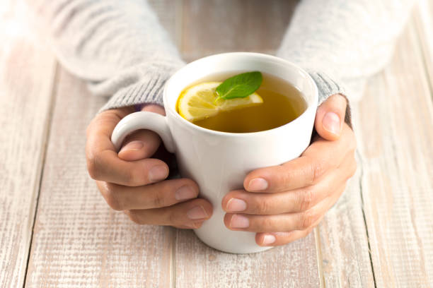 istock Woman with herbal tea 1002085638
