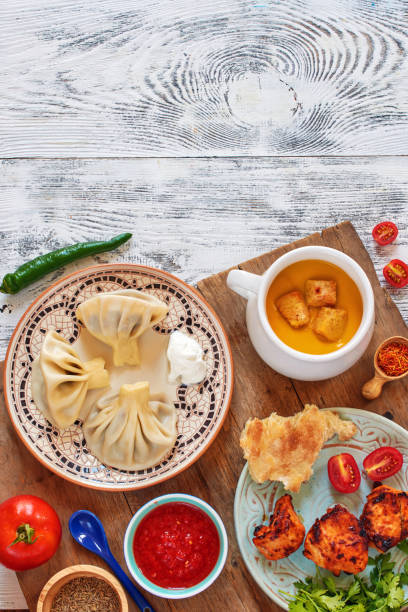 istock Khinkali, pumpkin soup, chicken kebab, tomato salsa and fresh veggies. 1002086522