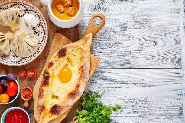 istock Top view of traditional dishes from Georgia on white table with copy space. 1002086686