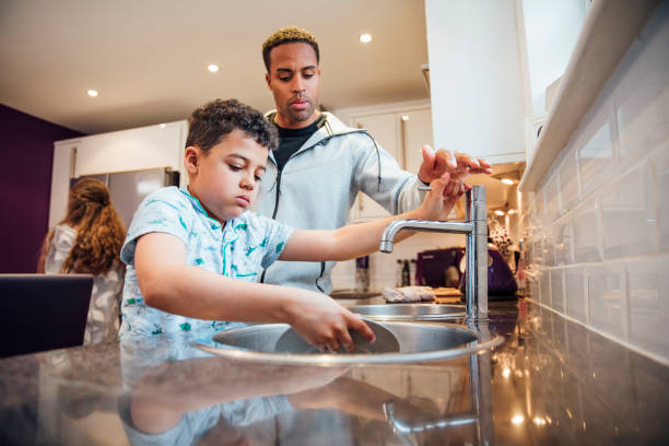 istock Washing the Dishes with Dad 1002090380