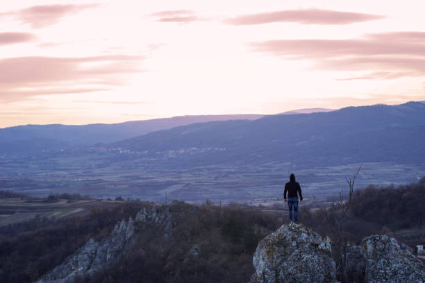 istock Man on top of the mountain 1002094868