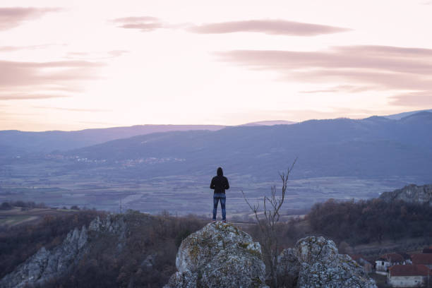 istock Man on top of the mountain 1002095120