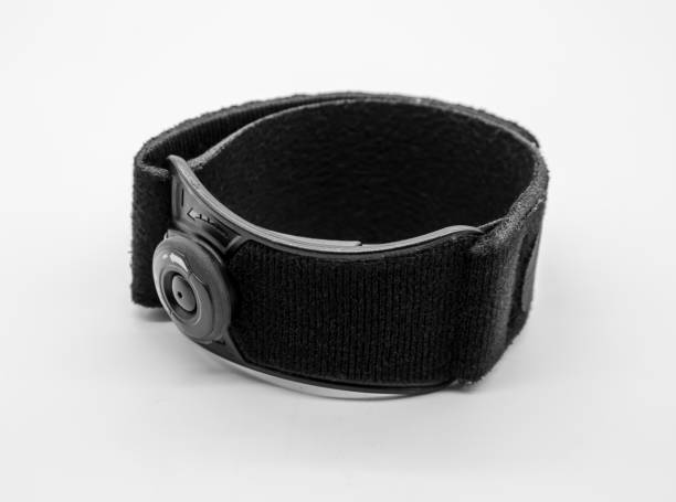 istock Black elbow brace with adjustable button to reduce pain isolated on white background 1002099678