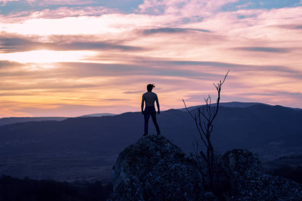 istock Man on top of the mountain 1002103512