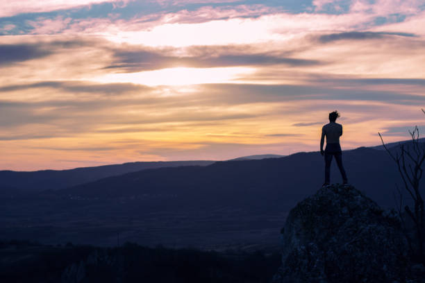istock Man on top of the mountain 1002103802