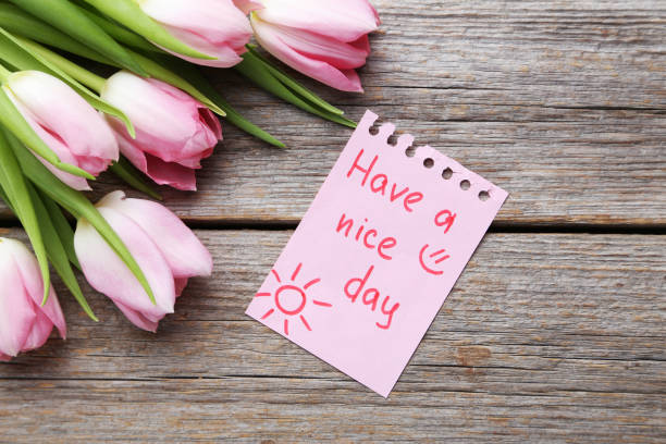 istock Bouquet of tulips on grey wooden table 1002106946