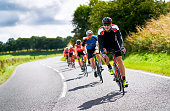 Cyclists racing on country roads.